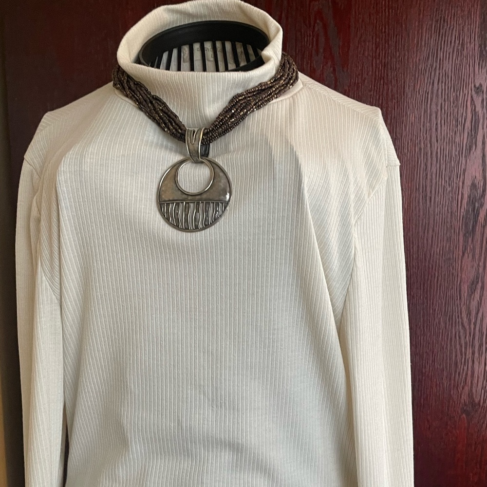 Make a statement with this twisted beaded necklace that has this unique pendant. - Picture 4 of 4